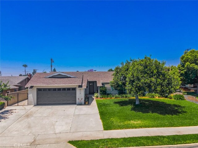 413 N Rimhurst Ave, Covina, CA 91724 - single story home with a garage, a front yard, stucco siding, and concrete driveway