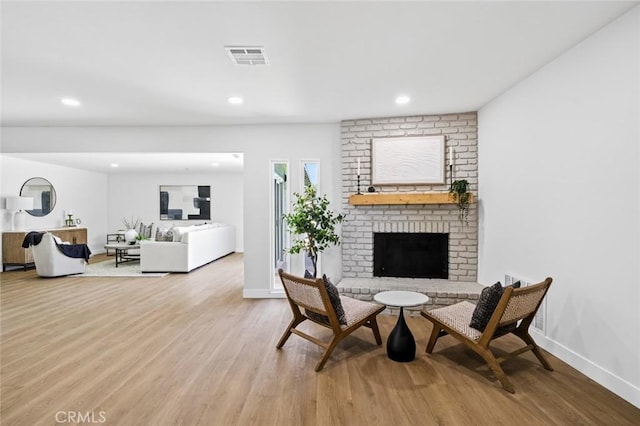 413 N Rimhurst Ave, Covina, CA 91724 - living area with wood finished floors, a fireplace, and recessed lighting
