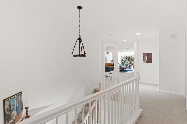 2534 Navarra Dr Unit C, Carlsbad, CA 92009 - hallway featuring carpet flooring, an upstairs landing, recessed lighting, and arched walkways