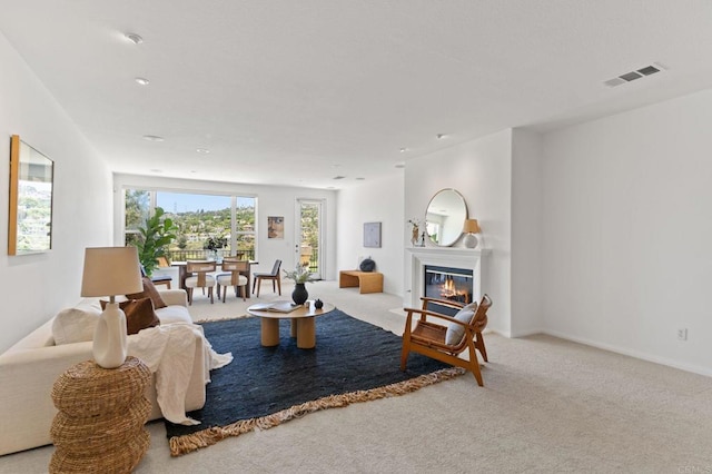 2534 Navarra Dr Unit C, Carlsbad, CA 92009 - living area featuring carpet and a glass covered fireplace