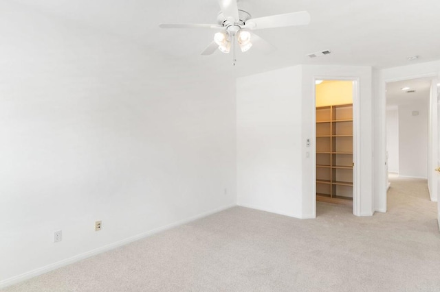 2534 Navarra Dr Unit C, Carlsbad, CA 92009 - unfurnished bedroom with a spacious closet, light colored carpet, and a ceiling fan