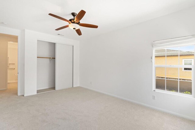 2534 Navarra Dr Unit C, Carlsbad, CA 92009 - unfurnished bedroom with light carpet, a closet, and ceiling fan