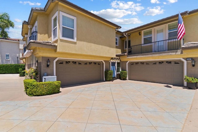 2534 Navarra Dr Unit C, Carlsbad, CA 92009 - view of front of home featuring a garage, driveway, and stucco siding