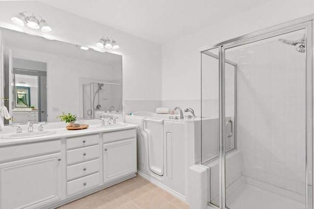 2534 Navarra Dr Unit C, Carlsbad, CA 92009 - bathroom featuring a stall shower, double vanity, and a garden tub