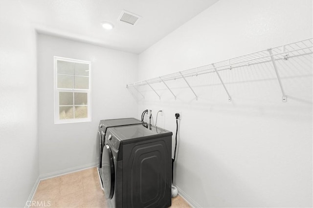 16017 Tanzinite Ln, Chino, CA 91708 - laundry room featuring washing machine and dryer and baseboards