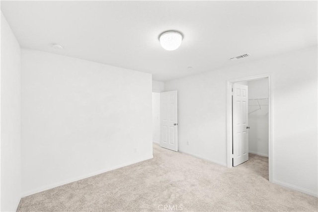 16017 Tanzinite Ln, Chino, CA 91708 - unfurnished bedroom featuring light colored carpet and a spacious closet