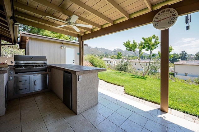 1926 Pamela Ln, Escondido, CA 92026 - view of patio featuring exterior kitchen, a mountain view, and a ceiling fan