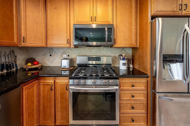 1926 Pamela Ln, Escondido, CA 92026 - kitchen featuring appliances with stainless steel finishes, dark stone counters, and backsplash