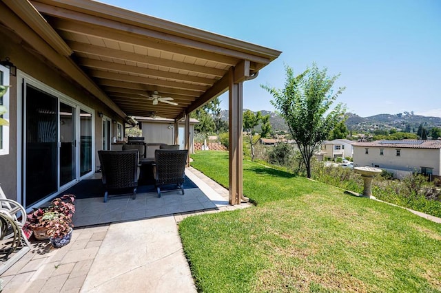 1926 Pamela Ln, Escondido, CA 92026 - view of grassy yard with ceiling fan, a patio, and a mountain view