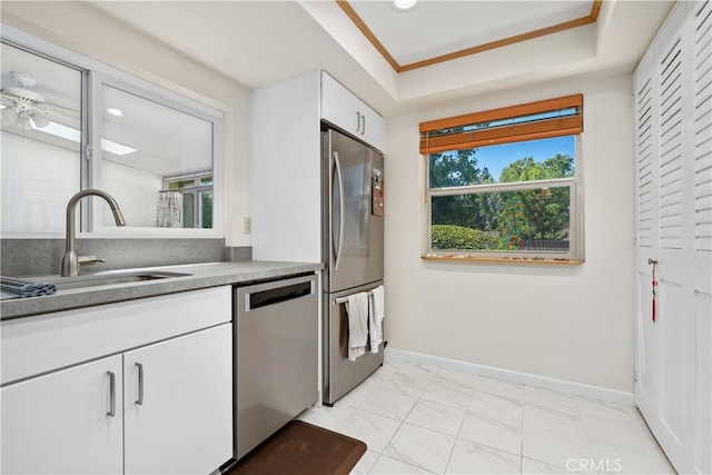 823 Daffodil, Riverside, CA 92507 - kitchen with stainless steel appliances, plenty of natural light, white cabinetry, and light marble finish floors