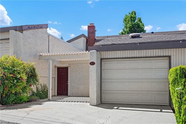 823 Daffodil, Riverside, CA 92507 - view of front facade featuring a pergola, an attached garage, stucco siding, and a chimney