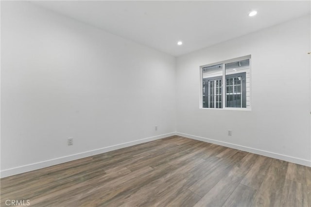 5171 S Wilton Pl, Los Angeles, CA 90062 - spare room with wood finished floors and recessed lighting