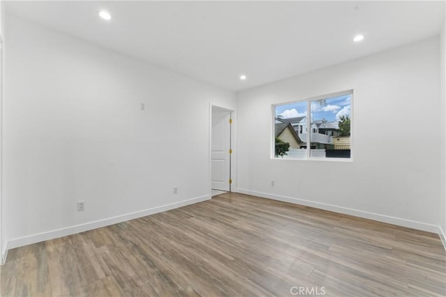 5171 S Wilton Pl, Los Angeles, CA 90062 - empty room featuring wood finished floors and recessed lighting