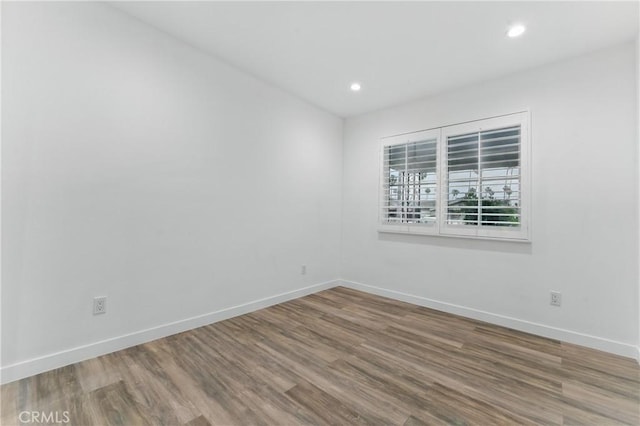 5171 S Wilton Pl, Los Angeles, CA 90062 - spare room featuring wood finished floors and recessed lighting