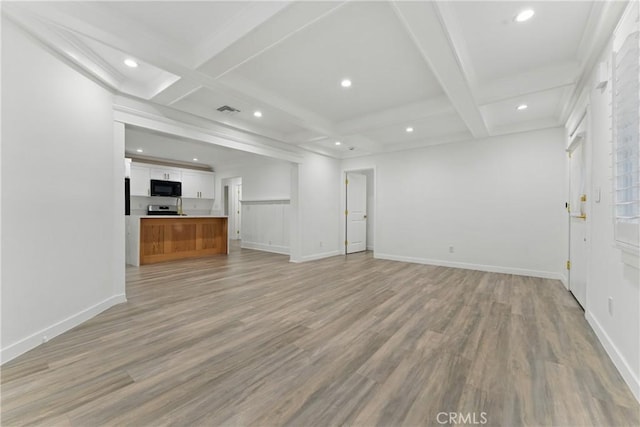 5171 S Wilton Pl, Los Angeles, CA 90062 - unfurnished living room with coffered ceiling, beamed ceiling, light wood-style flooring, and recessed lighting