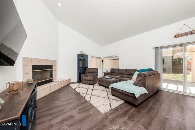 4018 Via Barbara, Lancaster, CA 93536 - living room with healthy amount of natural light, wood finished floors, high vaulted ceiling, and a fireplace
