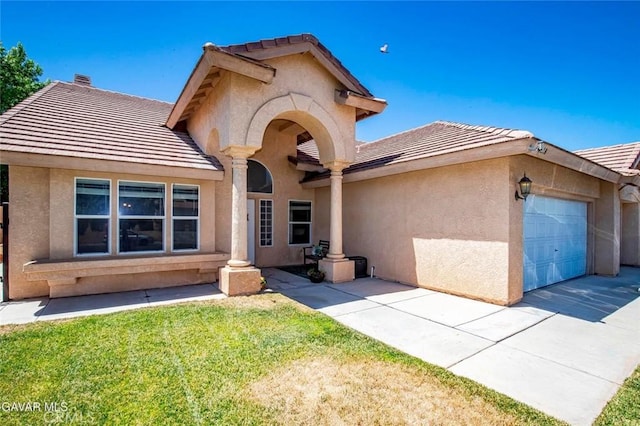 4018 Via Barbara, Lancaster, CA 93536 - view of front of property featuring stucco siding, an attached garage, a tile roof, driveway, and a front yard