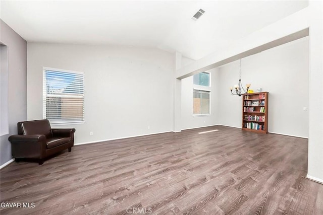 4018 Via Barbara, Lancaster, CA 93536 - unfurnished living room featuring a chandelier, wood finished floors, and vaulted ceiling