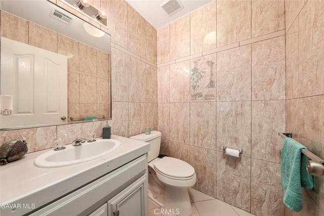 4018 Via Barbara, Lancaster, CA 93536 - half bathroom with tile walls, vanity, tile patterned flooring, and decorative backsplash