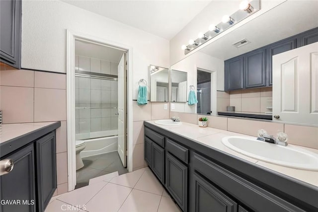 4018 Via Barbara, Lancaster, CA 93536 - bathroom with double vanity, tile walls, tile patterned flooring, and tub / shower combination