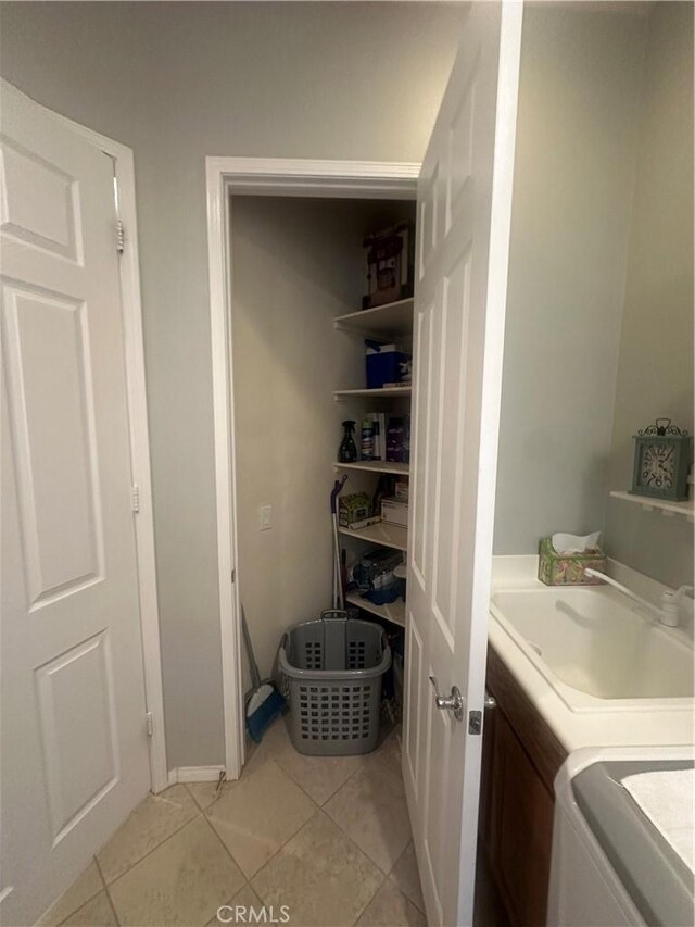 1185 Lantana Rd, Beaumont, CA 92223 - washroom featuring washer and dryer and light tile patterned flooring
