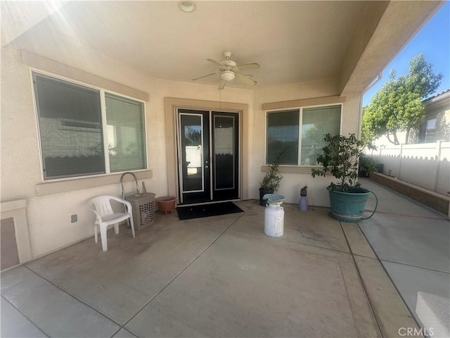 1185 Lantana Rd, Beaumont, CA 92223 - view of exterior entry featuring a patio area, a ceiling fan, and stucco siding
