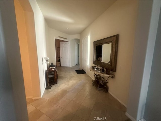 1185 Lantana Rd, Beaumont, CA 92223 - hall featuring light tile patterned floors and arched walkways