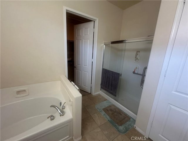 1185 Lantana Rd, Beaumont, CA 92223 - bathroom with a stall shower, a bath, and a closet