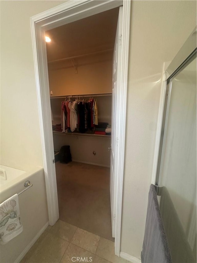 1185 Lantana Rd, Beaumont, CA 92223 - spacious closet featuring light carpet and light tile patterned flooring