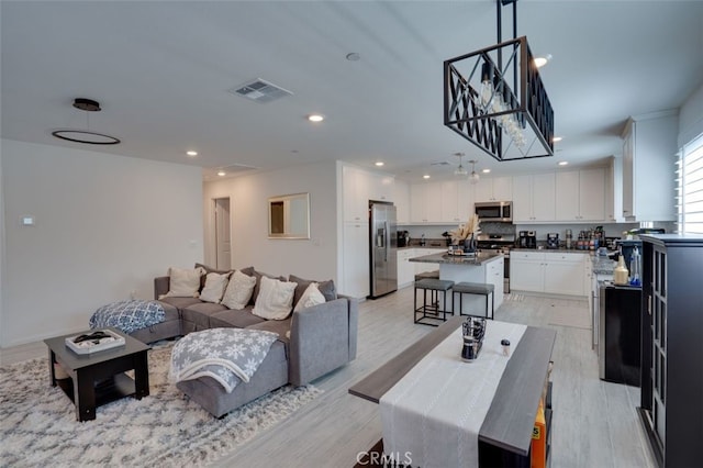 15147 Ridge Ln Unit 5, Fontana, CA 92336 - living room with light wood-style floors and recessed lighting