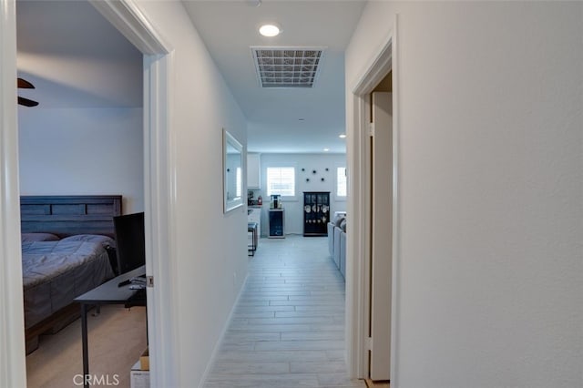 15147 Ridge Ln Unit 5, Fontana, CA 92336 - hall with light wood-style floors and recessed lighting