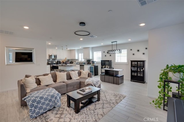 15147 Ridge Ln Unit 5, Fontana, CA 92336 - living room with recessed lighting and light wood finished floors