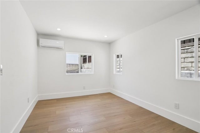17043 Celtic St, Granada Hills, CA 91344 - spare room featuring an AC wall unit, light wood-style floors, and recessed lighting