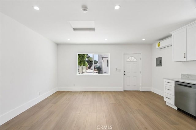 17043 Celtic St, Granada Hills, CA 91344 - kitchen with dishwasher, white cabinetry, light wood-style flooring, recessed lighting, and a wall mounted air conditioner