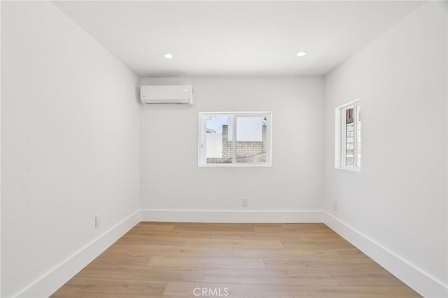 17043 Celtic St, Granada Hills, CA 91344 - spare room featuring a wall mounted AC, light wood-type flooring, and recessed lighting