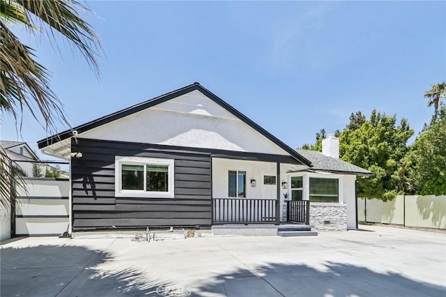 17043 Celtic St, Granada Hills, CA 91344 - rear view of property featuring a chimney
