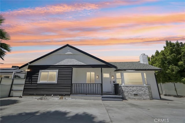 17043 Celtic St, Granada Hills, CA 91344 - view of front of house featuring a porch and a chimney