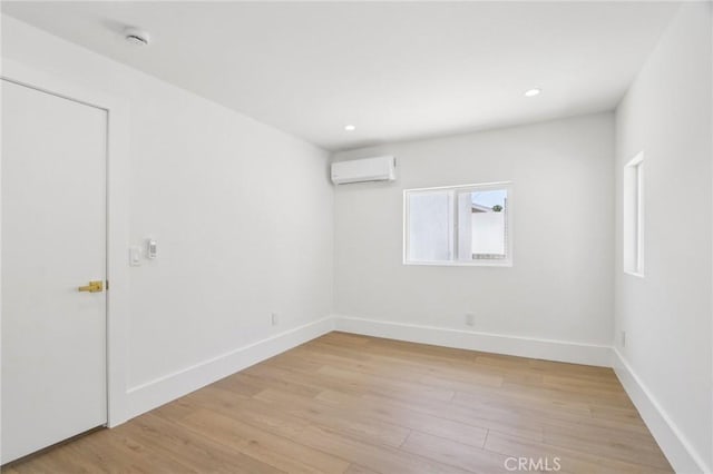 17043 Celtic St, Granada Hills, CA 91344 - spare room featuring a wall mounted AC, light wood finished floors, and recessed lighting