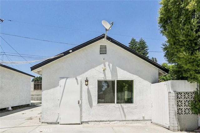 17043 Celtic St, Granada Hills, CA 91344 - rear view of property with stucco siding and a patio