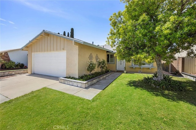 4161 E Fauna Ave, Anaheim, CA 92807 - view of front of property with a garage, driveway, and stucco siding