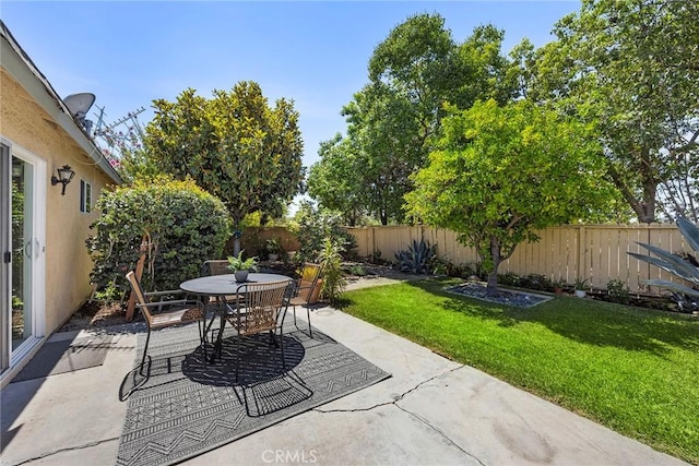 4161 E Fauna Ave, Anaheim, CA 92807 - fenced backyard with a patio area and outdoor dining area