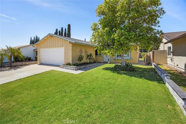 4161 E Fauna Ave, Anaheim, CA 92807 - view of front of house featuring an attached garage, driveway, and stucco siding