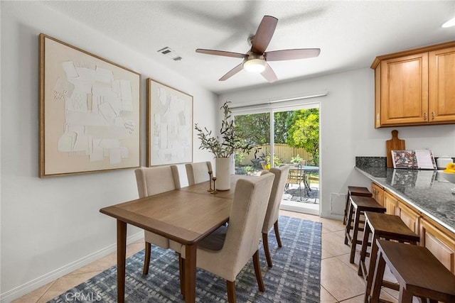 4161 E Fauna Ave, Anaheim, CA 92807 - dining space with light tile patterned floors and a ceiling fan