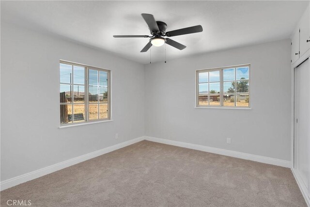 21815 Jelan Ave, Apple Valley, CA 92307 - carpeted spare room featuring baseboards and ceiling fan