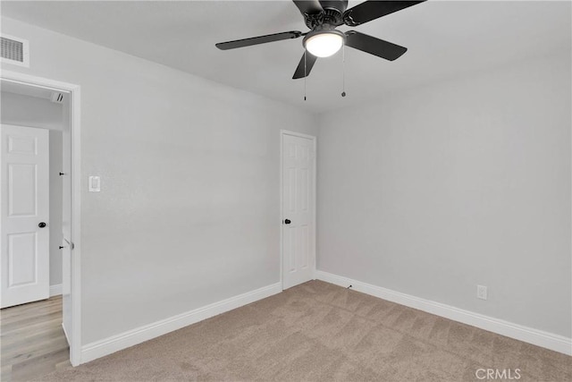 21815 Jelan Ave, Apple Valley, CA 92307 - spare room with light carpet and a ceiling fan
