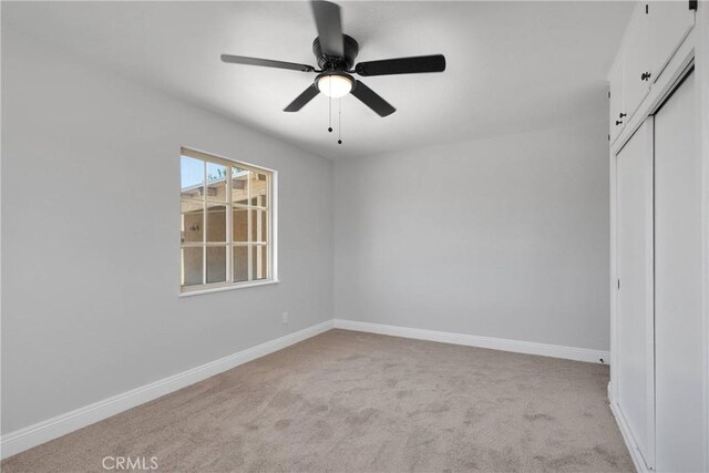 21815 Jelan Ave, Apple Valley, CA 92307 - unfurnished bedroom with carpet, a closet, and a ceiling fan