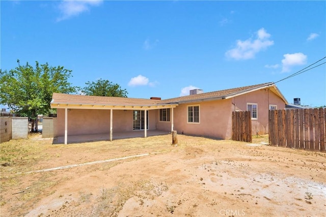 21815 Jelan Ave, Apple Valley, CA 92307 - back of property with a patio area and stucco siding