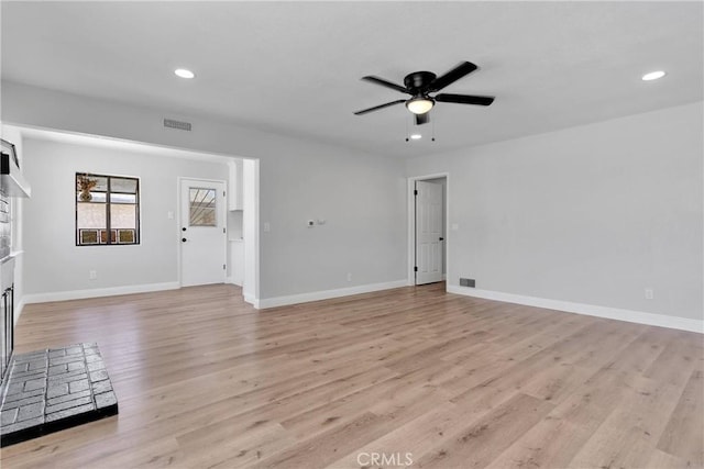 21815 Jelan Ave, Apple Valley, CA 92307 - unfurnished living room with a fireplace, ceiling fan, light wood-style flooring, and recessed lighting