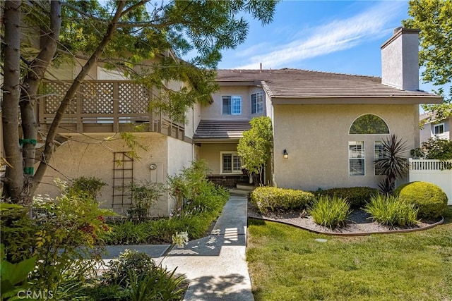 24343 Landover Rd Unit 139, Laguna Hills, CA 92653 - view of front of house with a chimney, a tile roof, and stucco siding