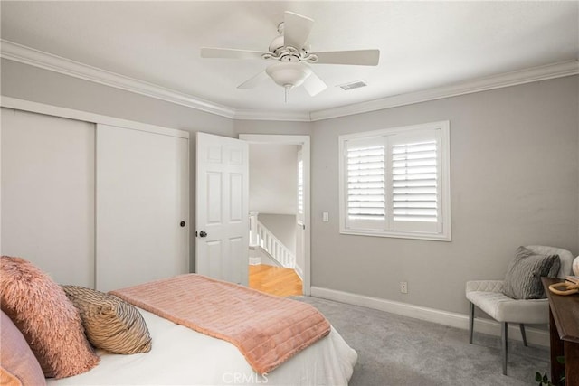 24343 Landover Rd Unit 139, Laguna Hills, CA 92653 - bedroom with a closet, carpet floors, ornamental molding, and a ceiling fan